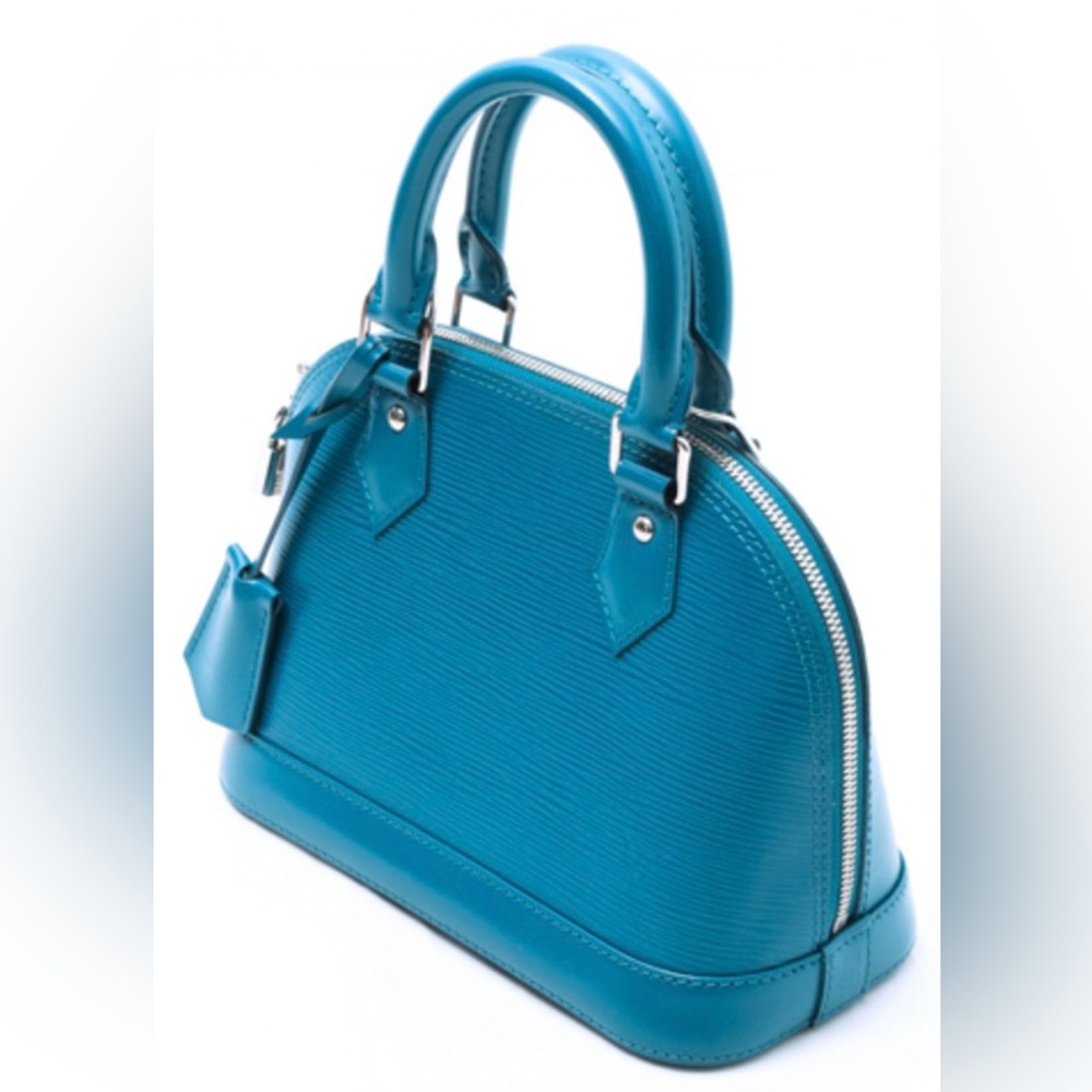 Like NEW: Louis Vuitton Alma BB in Cyan Epi Leather. Carried once or twice. EUC.
